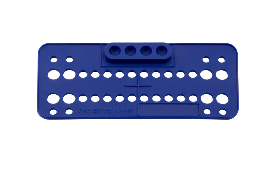 Blue orthodontic bracket placement pad with tooth positioning holes and patient name section for organizing brackets during bonding procedures